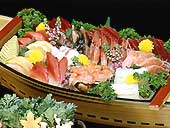 a boat style dishes of the sashimi